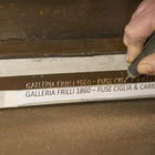 The Frilli Gallery signature chiseled at the base of the North Door replica